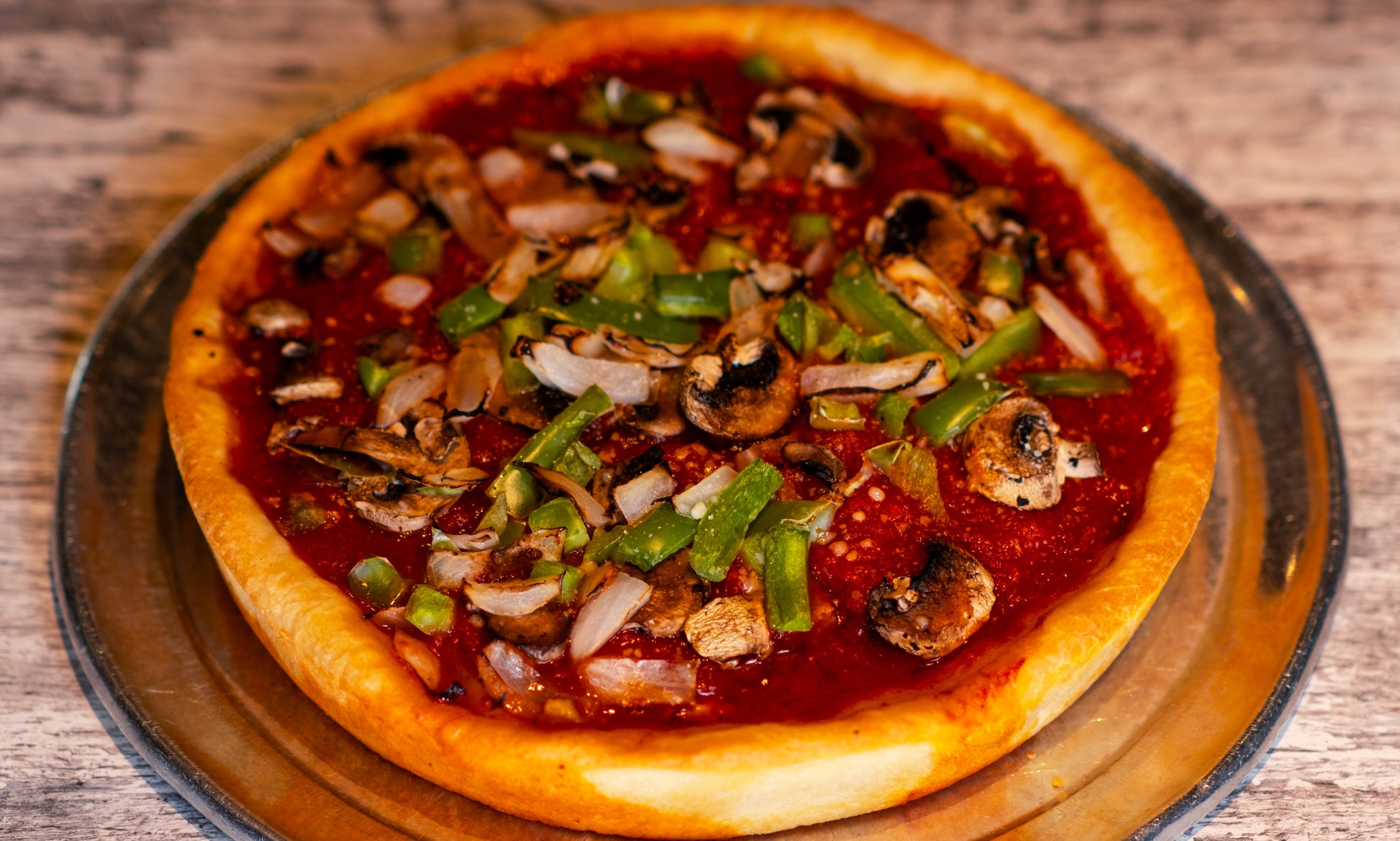 9-inch Chicago-style Deep Dish Combo pizza with cheese, pepperoni, and Graziano's Italian sausage on the bottom, then sauce, then onions, green peppers, and mushrooms on top.