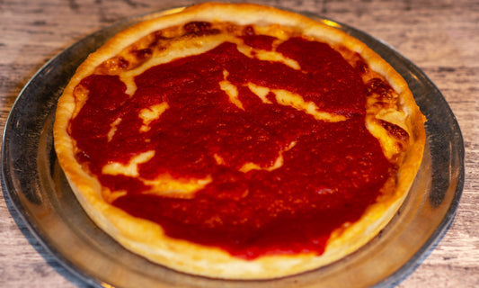 9-inch Chicago-style Deep Dish Cheese pizza with cheese on the bottom and sauce on top.