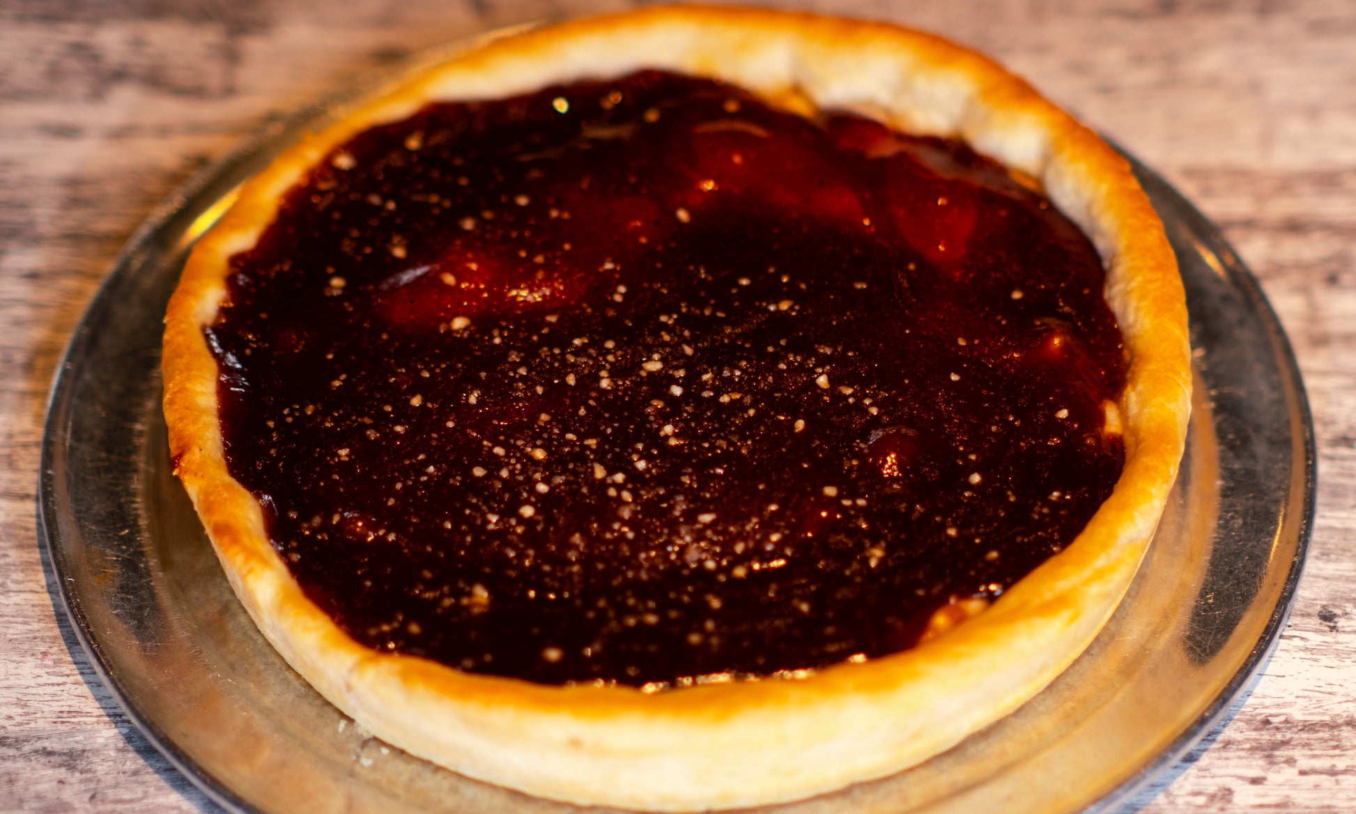 9-inch Chicago-style Deep Dish Western pizza with cheese on the bottom with pepperoni and Canadian bacon. Topped with barbecue sauce. 
